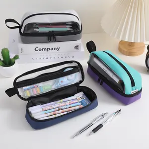 Detailed view of multi-layer Oxford pencil case showing spacious interior storage.