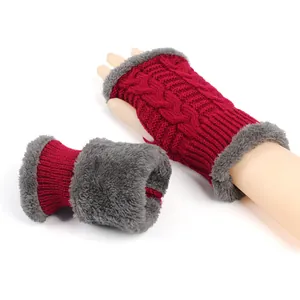 Detailed view of winter thick cable-knit fingerless gloves with soft grey faux fur trim