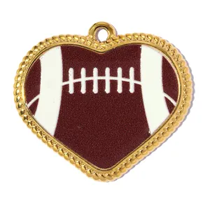 Close-up view of a heart-shaped pendant featuring an American football design and gold border.
