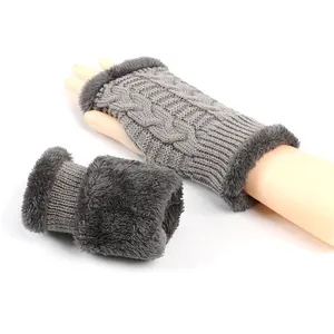 Close-up of thick cable knit arm warmers with soft plush faux fur lining