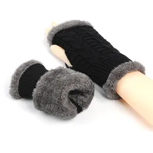 Detail of thick knit fingerless gloves with soft grey faux fur lining for winter.