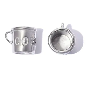 Detailed macro view of 3D stainless steel coffee cup charm with embossed text