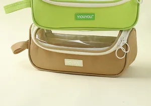 Detail view of stacked large capacity pencil cases with transparent panoramic windows
