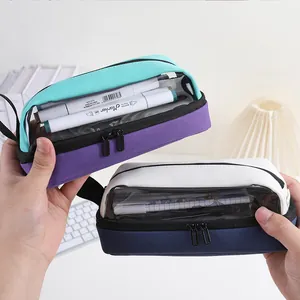 Detail of a large capacity canvas pencil case with a clear window for stationery.