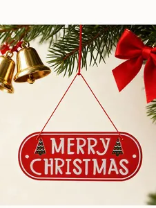 Macro view of red metal Merry Christmas hanging sign ornament on a festive Christmas tree