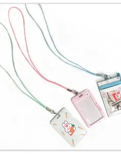 Close-up detail view of three colorful cute ID card holders with matching neck lanyards