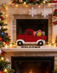 Red wooden truck decoration with Welcome sign on a festive fireplace mantel.