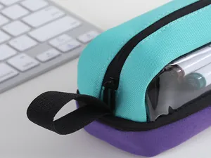 Close-up of dual-tone pencil case with transparent window and durable Oxford fabric