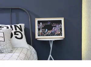Framed colorful Hong Kong city skyline night view scratch art on a minimalist white stool.