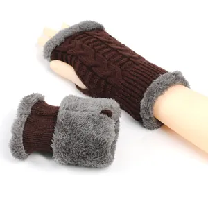 Detail view of brown knitted fingerless gloves with soft grey faux fur lining.