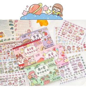 Macro detail of cute cartoon sticker booklets and decorative sheets for creative journaling.