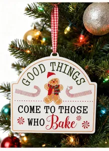 Detail of festive Christmas iron ornament featuring 'Good Things Come To Those Who Bake' text