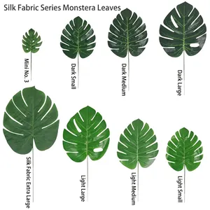 High-quality artificial Monstera leaves in various sizes and green shades for home decor.