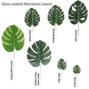 Various sizes of artificial monstera leaves in green for home and party decor.