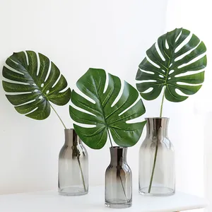 Lot de 3 feuilles de Monstera artificielles réalistes dans des vases en verre gris