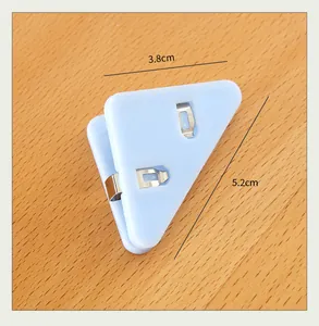Blue plastic triangle corner clip for paper organization with 3.8cm by 5.2cm dimensions