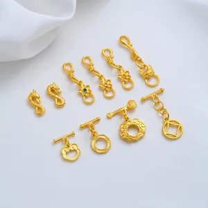Detailed view of 24K gold-plated Ruyi and OT jewelry connectors for DIY crafts.