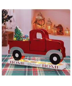 Rustic red wooden Christmas truck decor with 'HOME Sweet HOME' base in a cozy setting