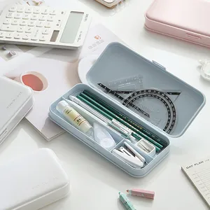 Minimalist pastel blue portable pencil case with organized multi-grid stationery storage