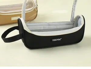 Detail of a minimalist black large capacity pencil bag with clear panoramic window