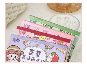 Close-up of cute cartoon sticker books with colorful covers and artistic designs