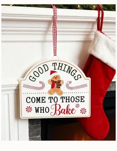 Detail view of white mini iron Christmas sign with gingerbread man hanging from mantel