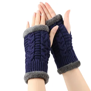 Thick navy knitted fingerless gloves with grey faux fur trim for winter hand warmth