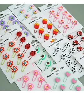 Collection of novelty cartoon paper clips in various shapes like flowers and hearts