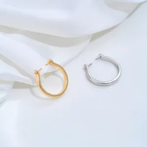 Close-up detail of polished gold and silver U-shaped open ring blanks for DIY jewelry