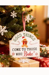 Detail view of a festive Christmas hanging sign featuring a gingerbread man illustration.