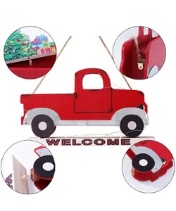 Detail view of a red wooden Christmas truck ornament featuring a Welcome sign and LEDs