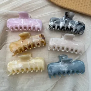 Variety set of marble ink pattern hair claw clips with elegant French style textures.