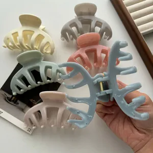 Set of pastel-colored dragon bone hair claw clips shown in a detailed close-up view