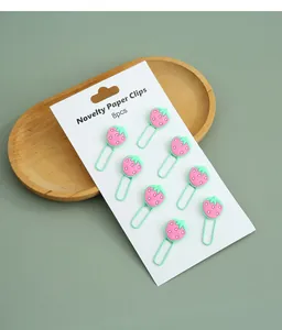 Close-up of 8pcs cute cartoon strawberry shaped metal paper clips on white card