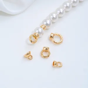 Detailed view of 14K gold-plated twisted and smooth jewelry connector rings for DIY