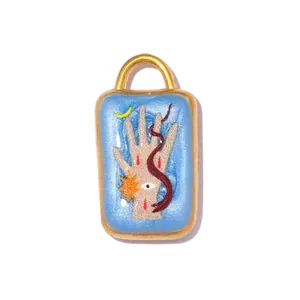 Mystical stainless steel pendant with hand, eye and snake design in shimmering blue enamel