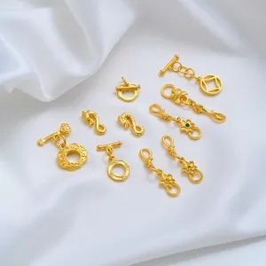 Detailed view of 24K gold plated Ruyi and floral jewelry connectors for DIY crafting
