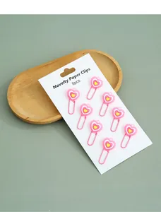 Detailed macro view of 8pcs pink heart-shaped novelty paper clips on display card