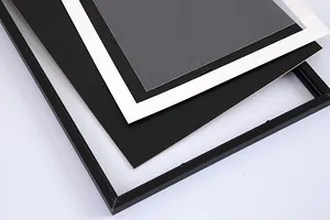 Detailed view of black scratch art frame components with white mat and clear sheet
