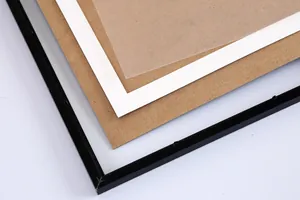 Detail view of the multi-layer scratch art photo frame with black border and wood backing.