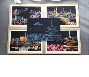 Colorful city landscape scratch art showing multiple world landmark night scenes