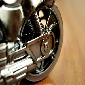Macro close-up view showing the exquisite metallic texture of a motorcycle alarm clock