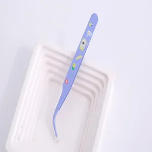 Close-up detail of purple curved stainless steel tweezers with cute cartoon biscuit patterns