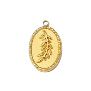 Detailed view of oval gold stainless steel pendant with embossed leaf design