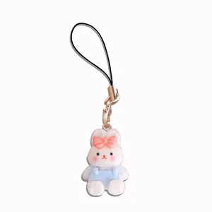 Cute resin rabbit charm with pink bow and blue overalls for phone strap accessory