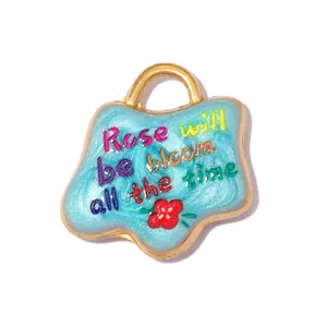 Detailed macro view of a light blue stainless steel charm with Rose lettering.