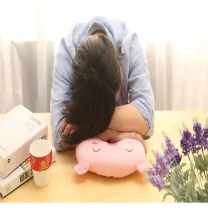 Soft pink cartoon plush U-shaped neck pillow for napping at a desk in the office