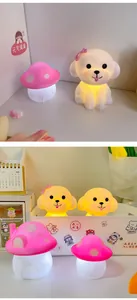 Detailed view of cute puppy and mushroom night lights with warm glow decor