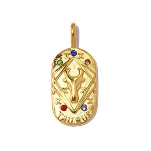 Close-up of vintage stainless steel Taurus zodiac pendant with colorful rhinestones