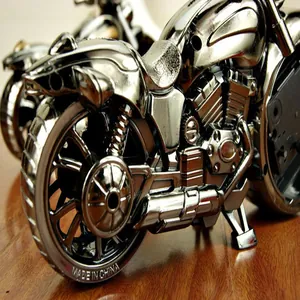 Detailed close-up view of a creative silver metallic motorcycle alarm clock ornament.